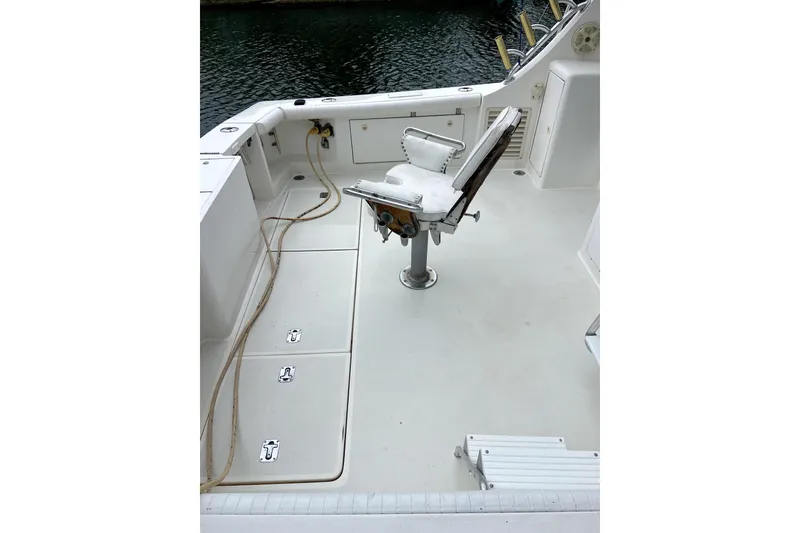 Slide: The Image of 2001 Egg Harbor 37 Convertible boat deck with fishing chair and storage compartments. - 4
