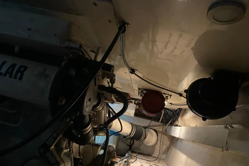 Slide: The Image of Engine room of a 2001 Egg Harbor 37 Convertible boat, showing mechanical components. - 40