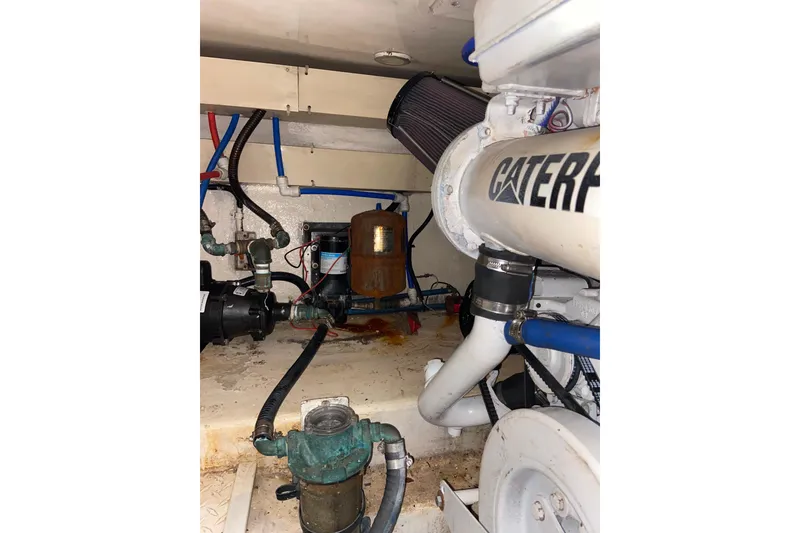 Slide: The Image of Engine room of 2001 Egg Harbor 37 Convertible boat with visible Caterpillar components. - 41