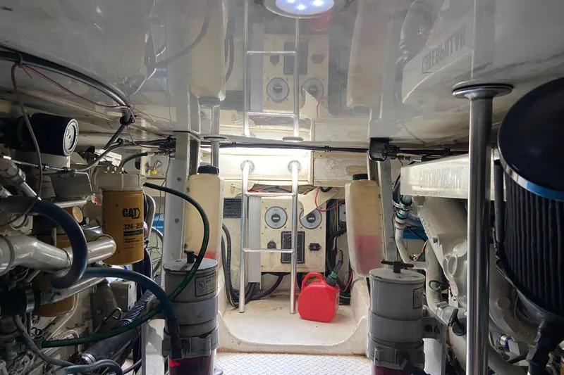 Slide: The Image of Engine room of 2001 Egg Harbor 37 Convertible boat, showcasing mechanical components and equipment. - 43
