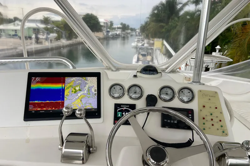Slide: The Image of Cockpit view of 2001 Egg Harbor 37 Convertible yacht with navigation instruments. - 53