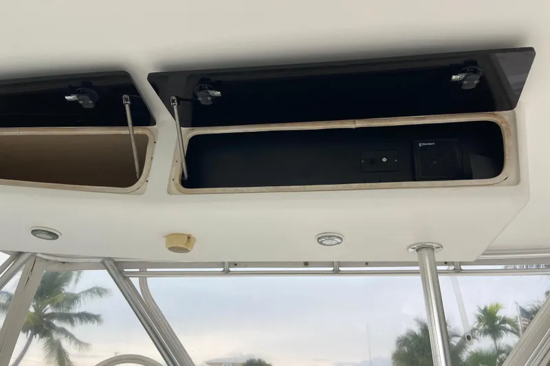 Slide: The Image of Open storage compartments on a 2001 Egg Harbor 37 Convertible boat interior. - 56