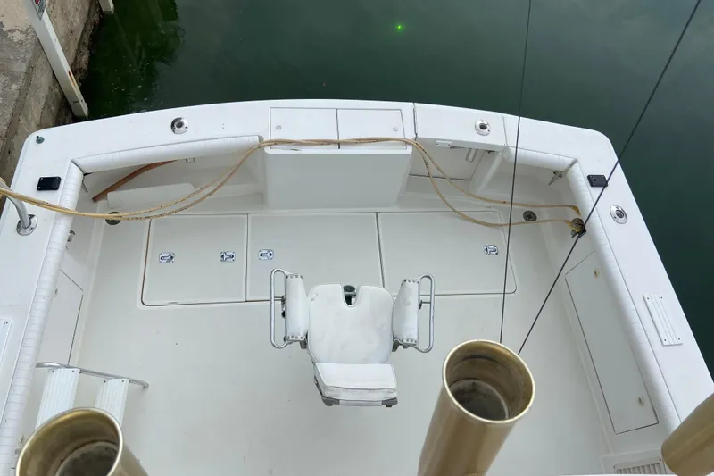 Slide: The Image of 2001 Egg Harbor 37 Convertible boat deck with fishing chair and storage compartments. - 64