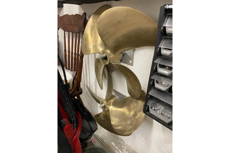 Slide: The Image of Propeller from a 2001 Egg Harbor 37 Convertible boat, mounted on a wall. - 67