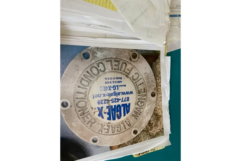 Slide: The Image of Propeller from a 2001 Egg Harbor 37 Convertible boat, mounted on a wall. - 68