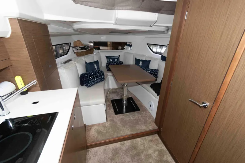 Slide: The Image of Interior of 2019 Jeanneau Leader 10.5 yacht with cozy seating and modern kitchen. - 16