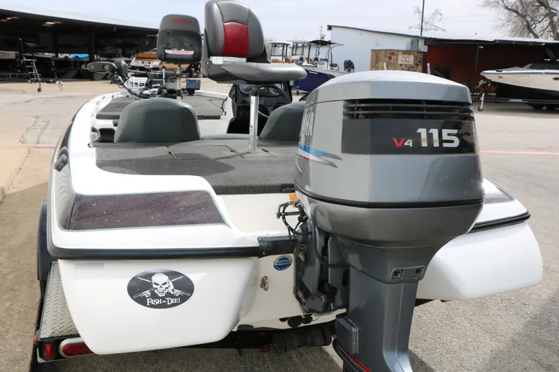 Slide: The Image of 2007 Skeeter SX180 boat with Yamaha V4 115 outboard motor, parked outdoors. - 11