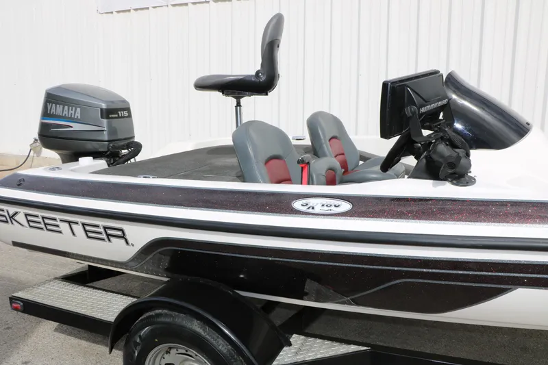 Slide: The Image of 2007 Skeeter SX180 boat with Yamaha 115 engine, featuring dual seats and Humminbird electronics. - 13