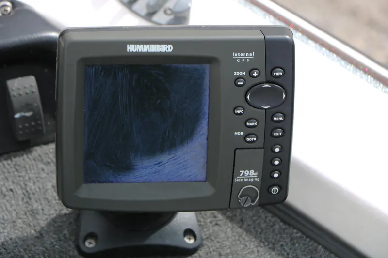 Slide: The Image of Humminbird GPS device on 2007 Skeeter SX180 boat dashboard. - 22