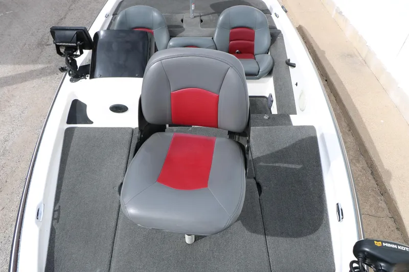 Slide: The Image of 2007 Skeeter SX180 boat interior with gray and red seating, featuring a Minn Kota trolling motor. - 25