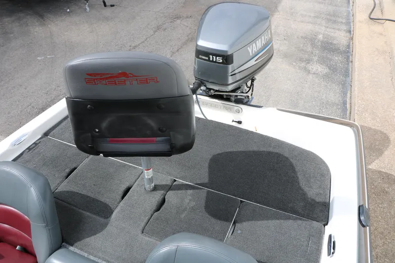 Slide: The Image of 2007 Skeeter SX180 boat with Yamaha 115 outboard motor, featuring rear seating and carpeted deck. - 28