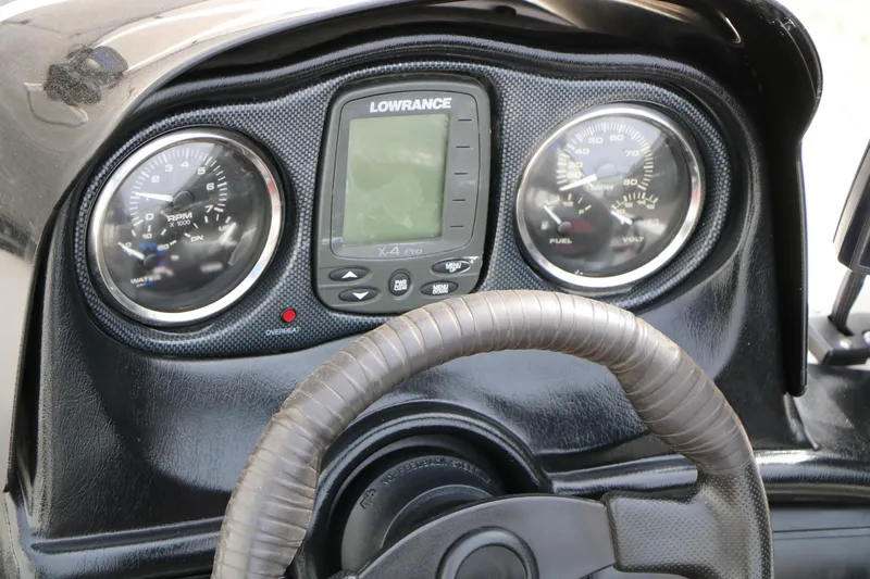 Slide: The Image of Dashboard of a 2007 Skeeter SX180 boat with gauges and Lowrance X4 Pro. - 29