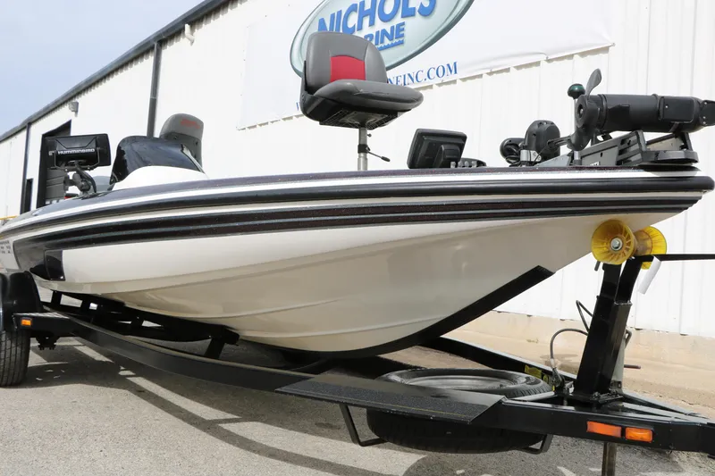 Slide: The Image of 2007 Skeeter SX180 boat on trailer, equipped with fishing gear and electronics. - 7