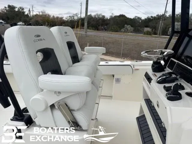 Slide: The Image of Cobia 285 Open Center Console 2026 with luxurious seating and helm console. - 5