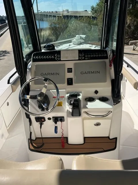 Slide: The Image of Helm of 2019 Everglades 253 Center Console boat with Garmin displays. - 5