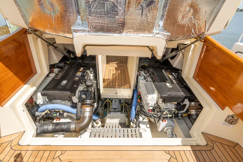 Slide: The Image of Engine compartment of a 2013 Hinckley Talaria 34 boat, showcasing dual engines. - 20