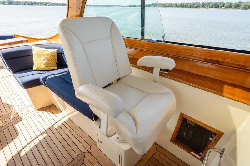 Slide: The Image of Luxury seating on 2013 Hinckley Talaria 34 yacht with scenic water view. - 9