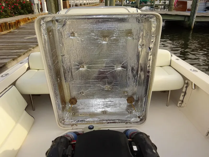 Slide: The Image of 2008 Hunt Yachts Harrier 25 engine compartment with open hatch, dockside view. - 33