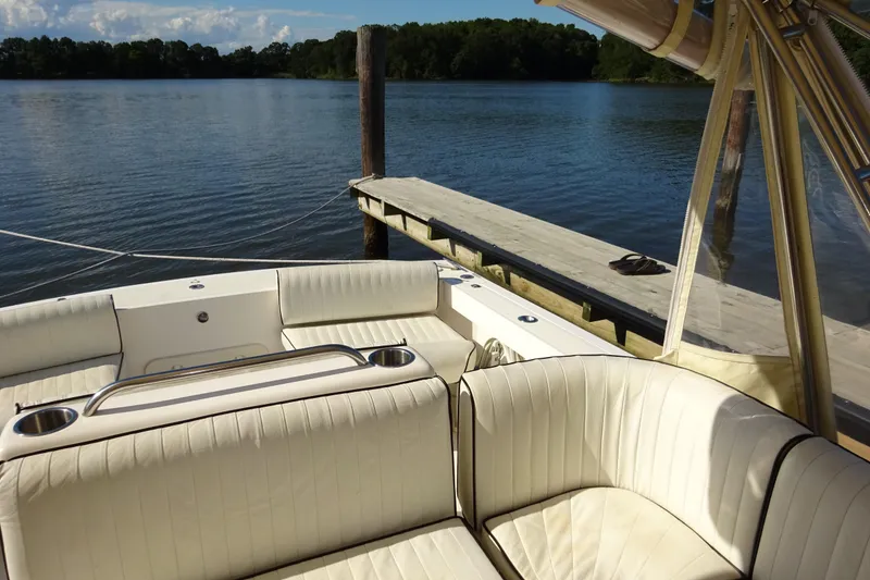 Slide: The Image of Luxurious 2007 Hunt Yachts Surfhunter 29 with elegant seating by a serene dockside. - 34