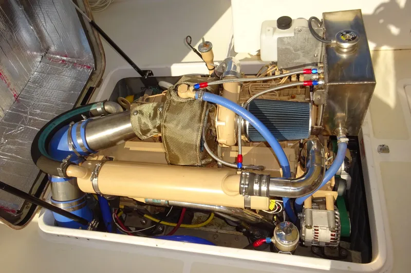 Slide: The Image of Engine compartment of 2007 Hunt Yachts Surfhunter 29, showcasing detailed mechanical components. - 55
