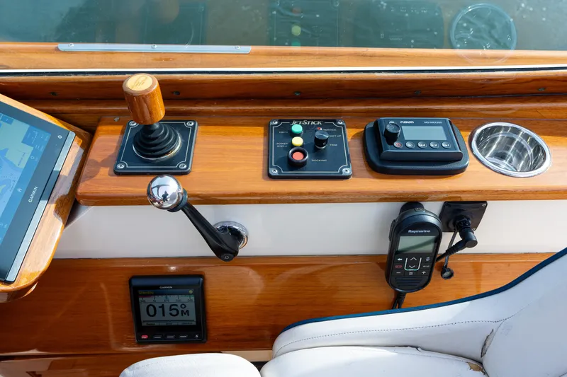 Slide: The Image of 2006 Hinckley Talaria 29 R helm with joystick, controls, and navigation equipment. - 10