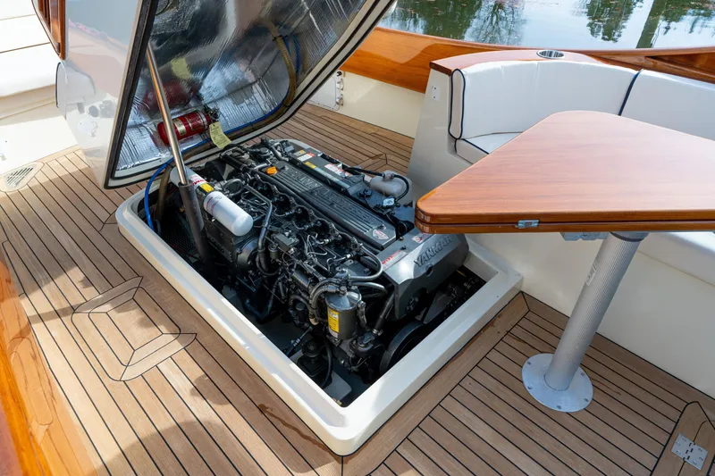 Slide: The Image of 2006 Hinckley Talaria 29 R engine compartment with Yanmar engine and teak deck. - 15