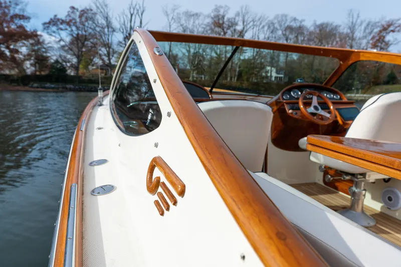 Slide: The Image of 2006 Hinckley Talaria 29 R boat with elegant wood detailing and luxurious interior. - 16