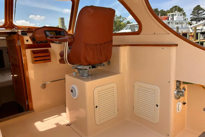 Slide: The Image of Interior of 1995 Hinckley Picnic Boat 36 Classic with brown leather seating. - 20