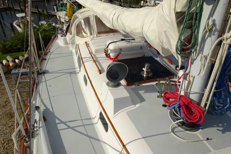 Slide: The Image of 1970 Hinckley Bermuda 40 Custom sailboat deck with ropes and covered sail. - 10