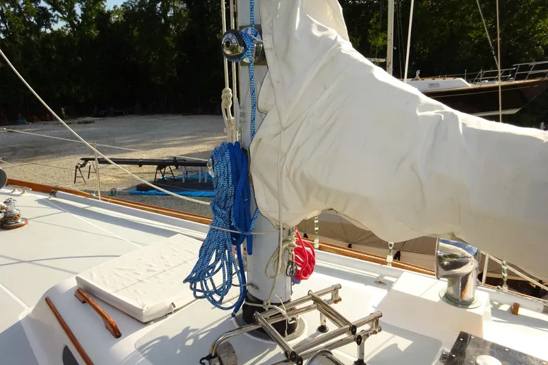 Slide: The Image of 1970 Hinckley Bermuda 40 Custom sailboat deck with ropes and covered sail. - 22