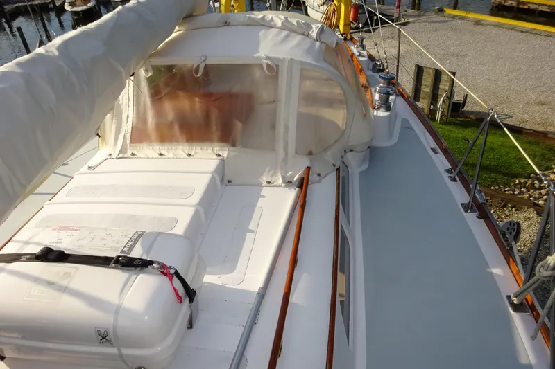 Slide: The Image of 1970 Hinckley Bermuda 40 Custom sailboat deck with covered cockpit and safety equipment. - 26