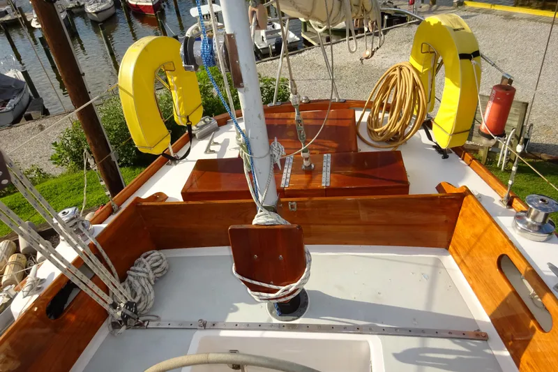 Slide: The Image of Hinckley Bermuda 40 Custom 1970 sailboat deck with wooden finish and yellow life rings. - 30