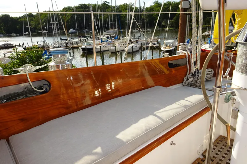 Slide: The Image of Hinckley Bermuda 40 Custom 1970 sailboat with polished wood and marina view. - 40