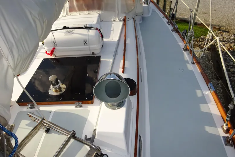 Slide: The Image of 1970 Hinckley Bermuda 40 Custom sailboat deck with lifeboat and winch. - 25