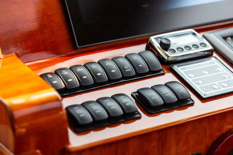 Slide: The Image of Control panel of 2014 Hinckley Talaria 43 yacht with switches and display. - 17