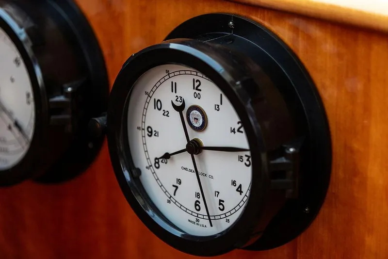 Slide: The Image of Analog clock on 2014 Hinckley Talaria 43 yacht's wooden interior. - 18