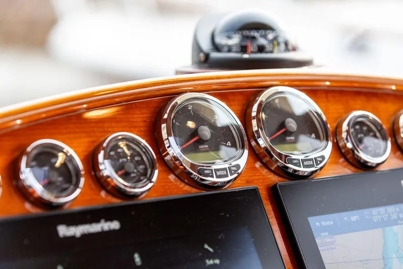Slide: The Image of Dashboard of 2014 Hinckley Talaria 43 with gauges and navigation screens. - 20