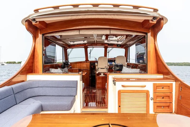 Slide: The Image of 2014 Hinckley Talaria 43 yacht interior with elegant wood finish and comfortable seating. - 21
