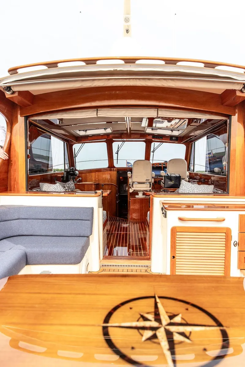 Slide: The Image of Interior of 2014 Hinckley Talaria 43 yacht with wooden finishes and seating. - 22