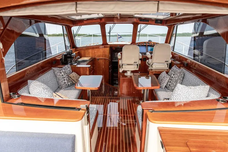 Slide: The Image of Interior of 2014 Hinckley Talaria 43 yacht with elegant wood finish and plush seating. - 23