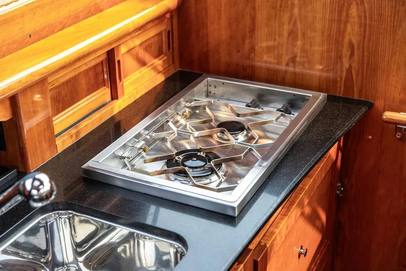 Slide: The Image of Stainless steel stove and sink in 2014 Hinckley Talaria 43 yacht kitchen. - 37
