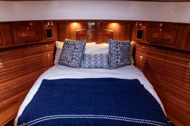 Slide: The Image of Luxurious cabin interior of 2014 Hinckley Talaria 43 yacht with elegant bedding. - 40