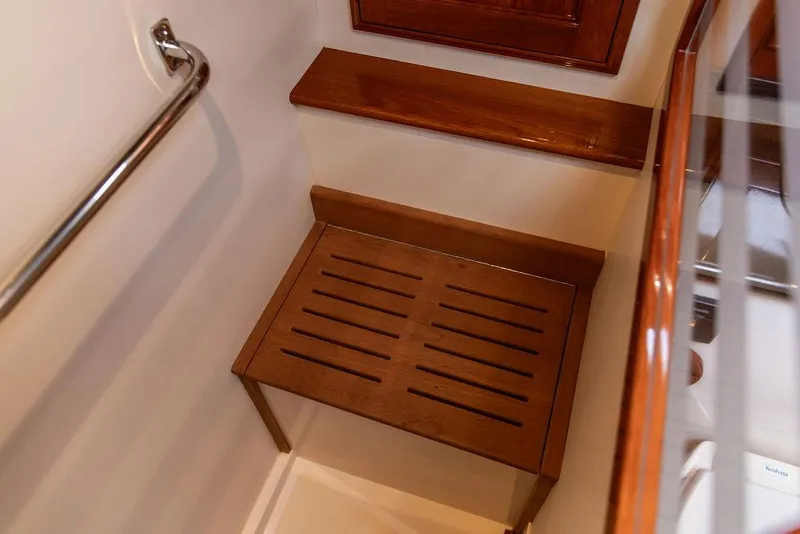 Slide: The Image of Wooden bench in 2014 Hinckley Talaria 43 yacht interior with polished rail. - 49