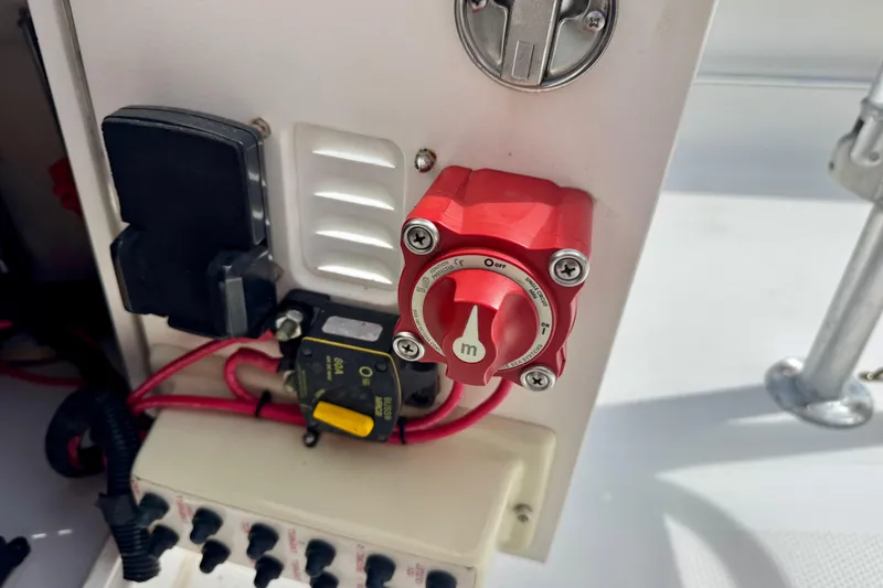 Slide: The Image of Control panel of a 2007 BlackJack 224 boat with red switch and wiring. - 13
