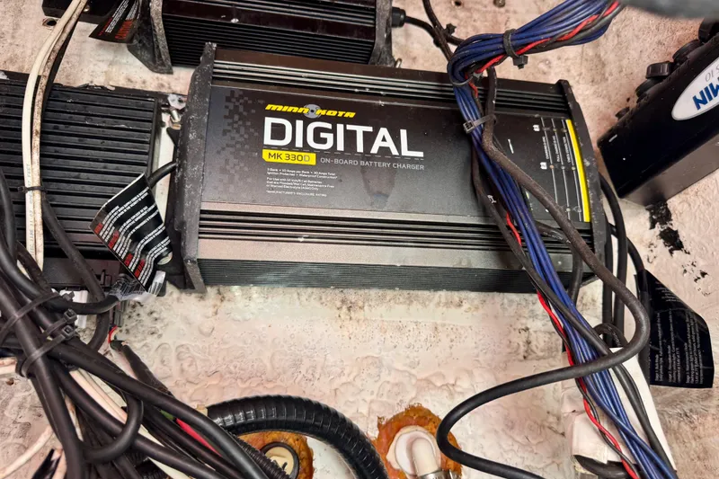 Slide: The Image of Minn Kota MK 330D on-board battery charger in BlackJack 224, 2007 model. - 14