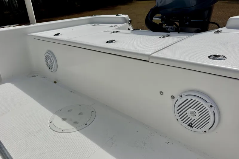 Slide: The Image of 2007 BlackJack 224 boat interior with speakers and storage compartments. - 15