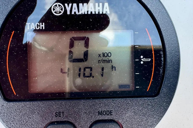 Slide: The Image of Yamaha tachometer displaying 0 RPM and 410.1 hours on BlackJack 224, 2007 model. - 9