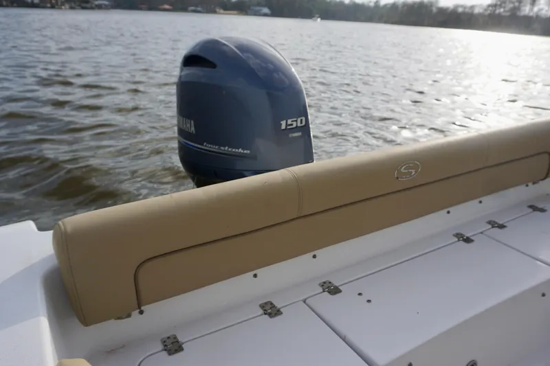 Slide: The Image of 2017 Sportsman Heritage 211 Center Console boat with Yamaha 150 engine on water. - 13
