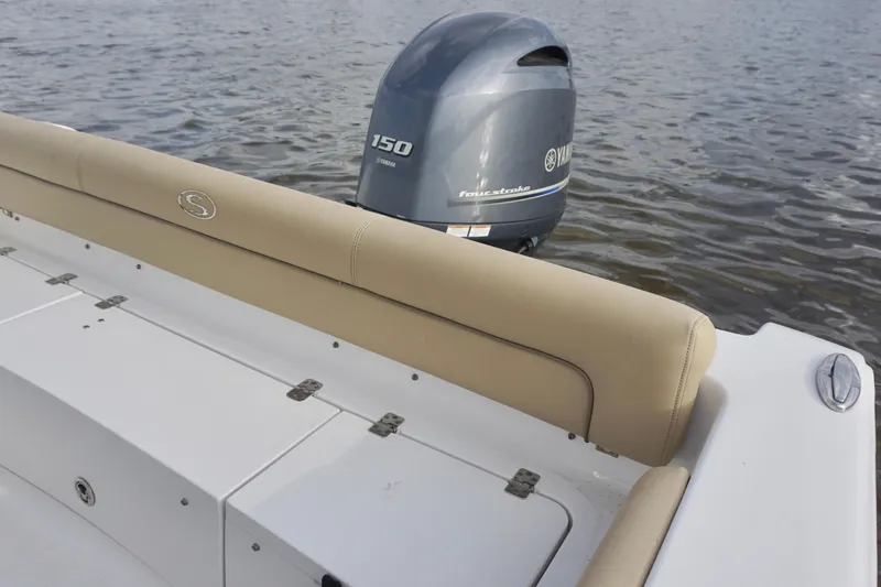 Slide: The Image of 2017 Sportsman Heritage 211 Center Console boat with Yamaha 150 engine on water. - 14