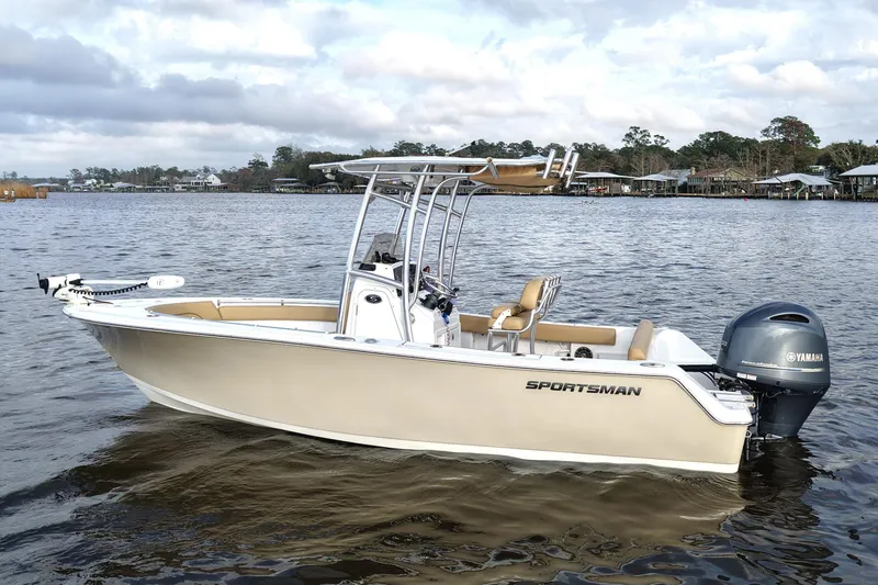 Slide: The Image of 2017 Sportsman Heritage 211 Center Console boat on calm water, featuring Yamaha outboard motor. - 3